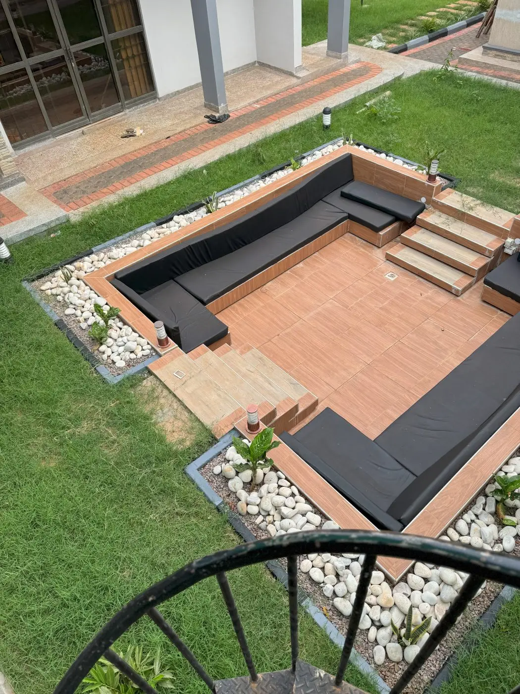 Sunken outdoor lounge, Home remodel, fountain and landscaping, Jinja
